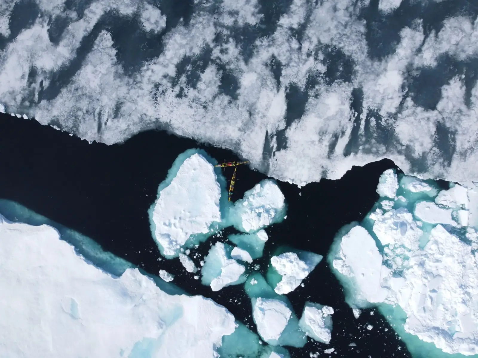 Expedition kayaks dwarfed by Arctic sea ice on the Northwest Passage route